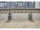 A row of two-car garages in a new townhome construction at 8321 Mount Kataka St, Littleton, CO 80125