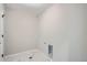 Dedicated laundry room with tile flooring, utility connections, and ample space at 8321 Mount Kataka St, Littleton, CO 80125