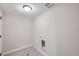 Laundry room with tile flooring and gray walls at 8321 Mount Kataka St, Littleton, CO 80125