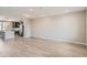 Spacious open-concept living area with modern flooring that seamlessly connects to the kitchen at 8321 Mount Kataka St, Littleton, CO 80125