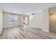 Bright living room boasts hardwood floors, neutral walls and plenty of natural light at 8321 Mount Kataka St, Littleton, CO 80125