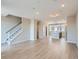 Spacious open-concept living area with modern flooring and seamless transition to the kitchen area at 8321 Mount Kataka St, Littleton, CO 80125