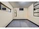 Unfinished basement area featuring carpeted floor, lighting and small window at 5738 W Canyon Ave, Littleton, CO 80128