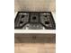 Stainless steel KitchenAid cooktop with five burners and sleek design, set in quartz countertop at 5626 W 142Nd Ave, Broomfield, CO 80020
