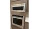 The kitchen features a stainless steel KitchenAid microwave and oven at 5626 W 142Nd Ave, Broomfield, CO 80020