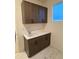 Functional laundry room with sink, cabinets, a large window, and marble-look tile floor at 5626 W 142Nd Ave, Broomfield, CO 80020