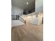 Spacious living room features hardwood floors, high ceilings, and a staircase with black metal railing at 5626 W 142Nd Ave, Broomfield, CO 80020