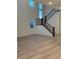 Open-concept living area with tall ceilings, lots of natural light, and hardwood floors at 5626 W 142Nd Ave, Broomfield, CO 80020