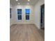 This living room has wood flooring and three windows at 5626 W 142Nd Ave, Broomfield, CO 80020