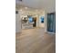 Open-concept living area with hardwood floors and sliding doors to outdoor at 5626 W 142Nd Ave, Broomfield, CO 80020