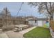 Charming backyard with pavers, raised garden beds, artificial turf, and decorative string lights at 3956 Kalamath St, Denver, CO 80211