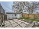 Backyard features concrete pavers, artificial turf, and a gray shed with a colorful accent wall at 3956 Kalamath St, Denver, CO 80211