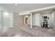 Finished basement area showcasing neutral colored walls and carpet, along with recreational equipment at 3956 Kalamath St, Denver, CO 80211