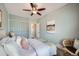Bedroom featuring soft, neutral walls, a comfortable bed and a ceiling fan at 3956 Kalamath St, Denver, CO 80211