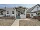 Charming home with a brick facade, inviting front porch and well maintained landscaping at 3956 Kalamath St, Denver, CO 80211
