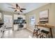 Well-lit kitchen featuring white cabinetry, stainless steel appliances, and a breakfast bar area at 3956 Kalamath St, Denver, CO 80211
