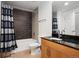 Bathroom featuring a bathtub, shower, and a modern vanity with a sink and mirror at 891 14Th St # 2105, Denver, CO 80202