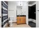 Bathroom features a modern vanity with granite countertop, decorative mirror, and modern fixtures at 891 14Th St # 2105, Denver, CO 80202