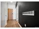 Hallway with light wood floors, contrasting paint, and a unique piano key art installation on the wall at 891 14Th St # 2105, Denver, CO 80202