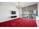 Bright living room with modern chandelier and large windows allowing natural light at 891 14Th St # 2105, Denver, CO 80202