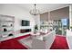 Bright living room with city views from the large windows and stylish decor at 891 14Th St # 2105, Denver, CO 80202
