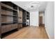 Bright living area features built-in shelving with workspace and modern lighting, creating a stylish and functional design at 891 14Th St # 2105, Denver, CO 80202
