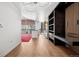 Bright open-concept living space, showcasing hardwood floors, sleek built-ins, and a glimpse into the modern kitchen at 891 14Th St # 2105, Denver, CO 80202