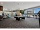 Bright recreation room featuring a pool table, seating area and an easy access to the building's community pool at 891 14Th St # 2105, Denver, CO 80202