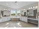 Luxurious bathroom with double sinks, a soaking tub, and natural light from large windows at 11522 Trona Ct, Parker, CO 80138