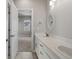 Modern bathroom featuring double sinks, white cabinets and a decorative mirror over the vanity at 11522 Trona Ct, Parker, CO 80138