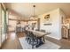 Open dining area with views of the modern kitchen, natural light, and room for entertaining at 11522 Trona Ct, Parker, CO 80138