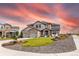 Beautiful two-story home featuring stone accents, a manicured lawn, and a welcoming entrance at 11522 Trona Ct, Parker, CO 80138
