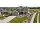 An aerial view shows the home's exterior, driveway, manicured lawn, and stone accents at 11522 Trona Ct, Parker, CO 80138