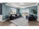 Cozy living room featuring a neutral color palette, large windows, and plush seating at 11522 Trona Ct, Parker, CO 80138
