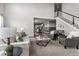 Open concept living room with a view of the staircase, dining area and kitchen at 11522 Trona Ct, Parker, CO 80138