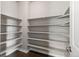 Bright pantry featuring open shelving and hardwood floors, providing ample storage space at 11522 Trona Ct, Parker, CO 80138