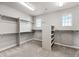 Spacious walk-in closet with ample shelving and storage space, and natural light at 11522 Trona Ct, Parker, CO 80138