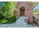 Close up view of the brick front porch with classic design elements and address display at 1278 Dexter St, Denver, CO 80220