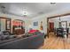 Comfortable living room with open layout flowing into the dining area and wooden accents at 1278 Dexter St, Denver, CO 80220