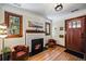 Inviting living room featuring a fireplace, hardwood floors, and comfortable seating at 1278 Dexter St, Denver, CO 80220