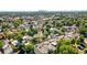 Wide aerial view of a neighborhood with mature trees and diverse home styles near downtown at 4429 Winona Ct, Denver, CO 80212