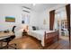 Bright bedroom with hardwood floors, natural light, and stylish desk for an office at 4429 Winona Ct, Denver, CO 80212