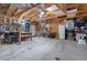 Spacious garage interior with exposed beams and ample storage space and work area at 4429 Winona Ct, Denver, CO 80212