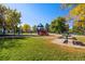 Community park with a playground, picnic tables, and mature trees, a great place for families at 4429 Winona Ct, Denver, CO 80212