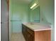 Bathroom featuring a sink, vanity and a shower with glass door at 1971 Kerr Gulch Rd, Evergreen, CO 80439