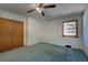 Bedroom with light walls, and a window allowing for natural light at 1971 Kerr Gulch Rd, Evergreen, CO 80439