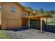 Exterior view showcasing the home's garage, carport, and stone foundation detailing at 1971 Kerr Gulch Rd, Evergreen, CO 80439