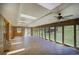Bright sun room featuring multiple skylights, several ceiling fans, and lots of windows at 1971 Kerr Gulch Rd, Evergreen, CO 80439