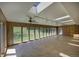 Bright sun room with skylights, fan, wall of windows, and tile flooring at 1971 Kerr Gulch Rd, Evergreen, CO 80439