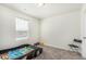 Bright bedroom with a playful car-themed bed and ample space for toys and activities at 803 N Bently St, Watkins, CO 80137